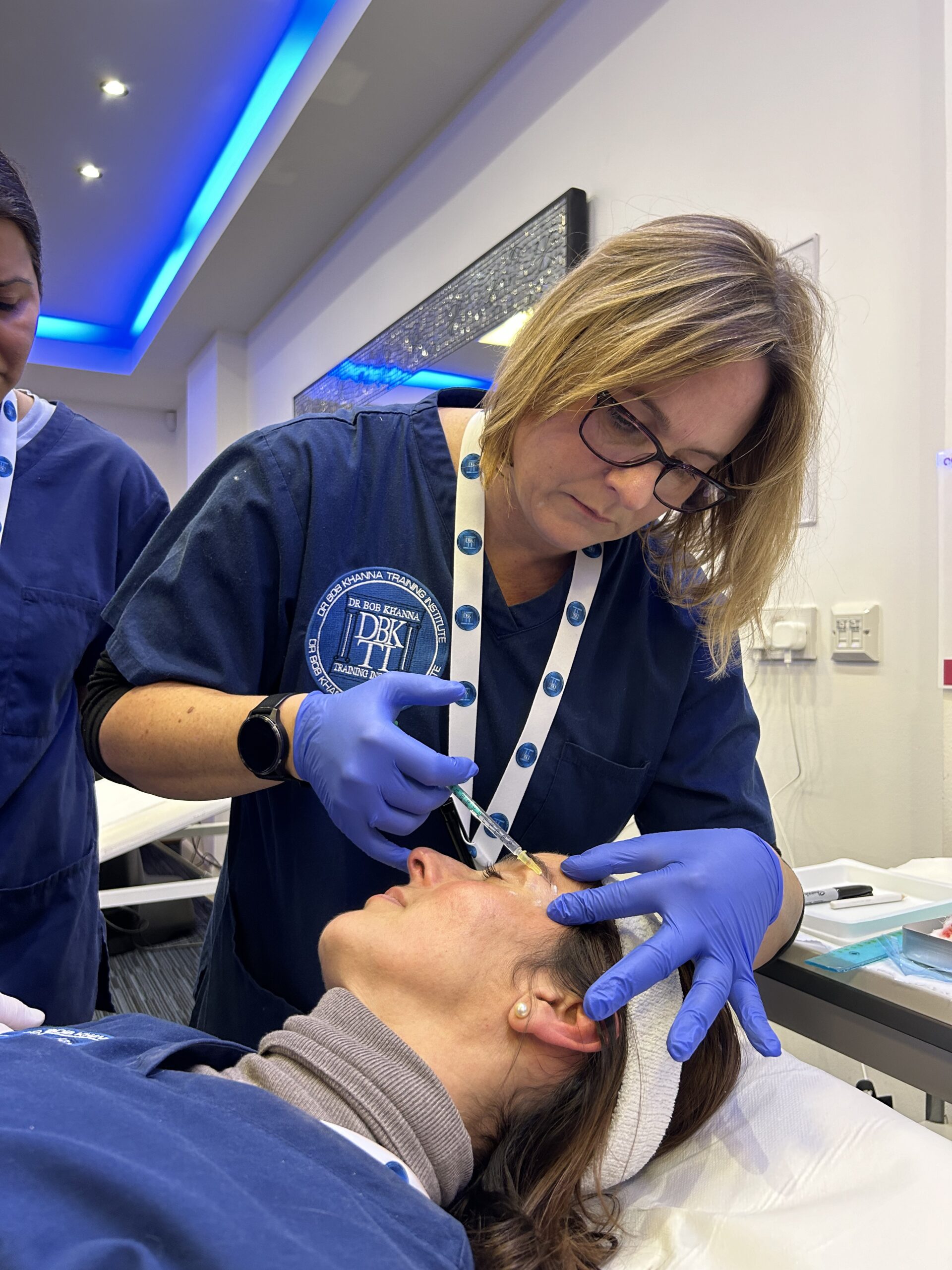 A doctor on a training course performing BTX treatment