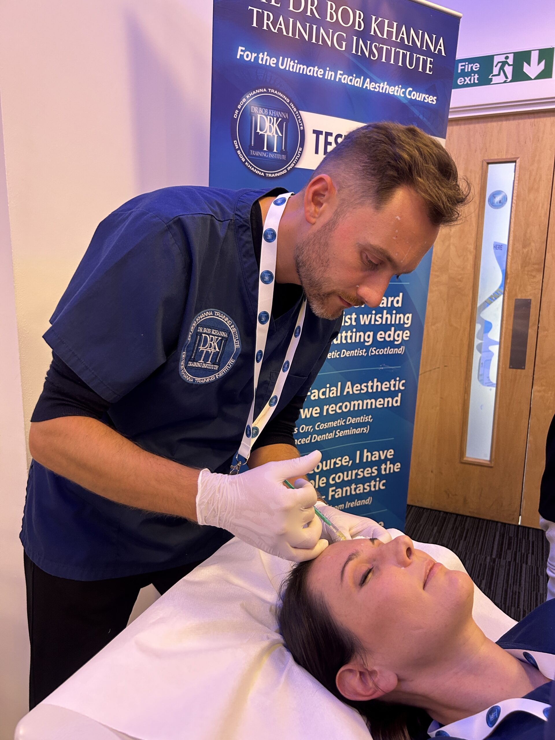 A doctor on a training course performing aesthetic treatment